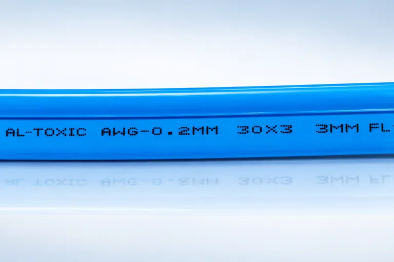 Printed identification marking along the blue PVC sheath of a submersible pump cable